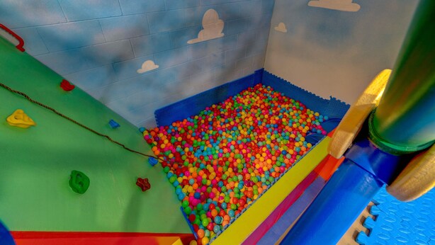 A play area with a ball pit, colorful play structures, and a slide. - 6 Mins to Disney Game Themed Rooms Pool Spa (Kissimmee)