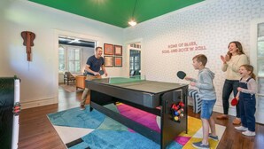A room with a ping pong table, a dartboard, and a billiards table. - 6BR Home Private Pool Spa Games Gazebo (Memphis)