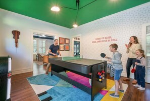 A room with a ping pong table, a dartboard, and a billiards table. - 6BR Home Private Pool Spa Games Gazebo (Memphis)