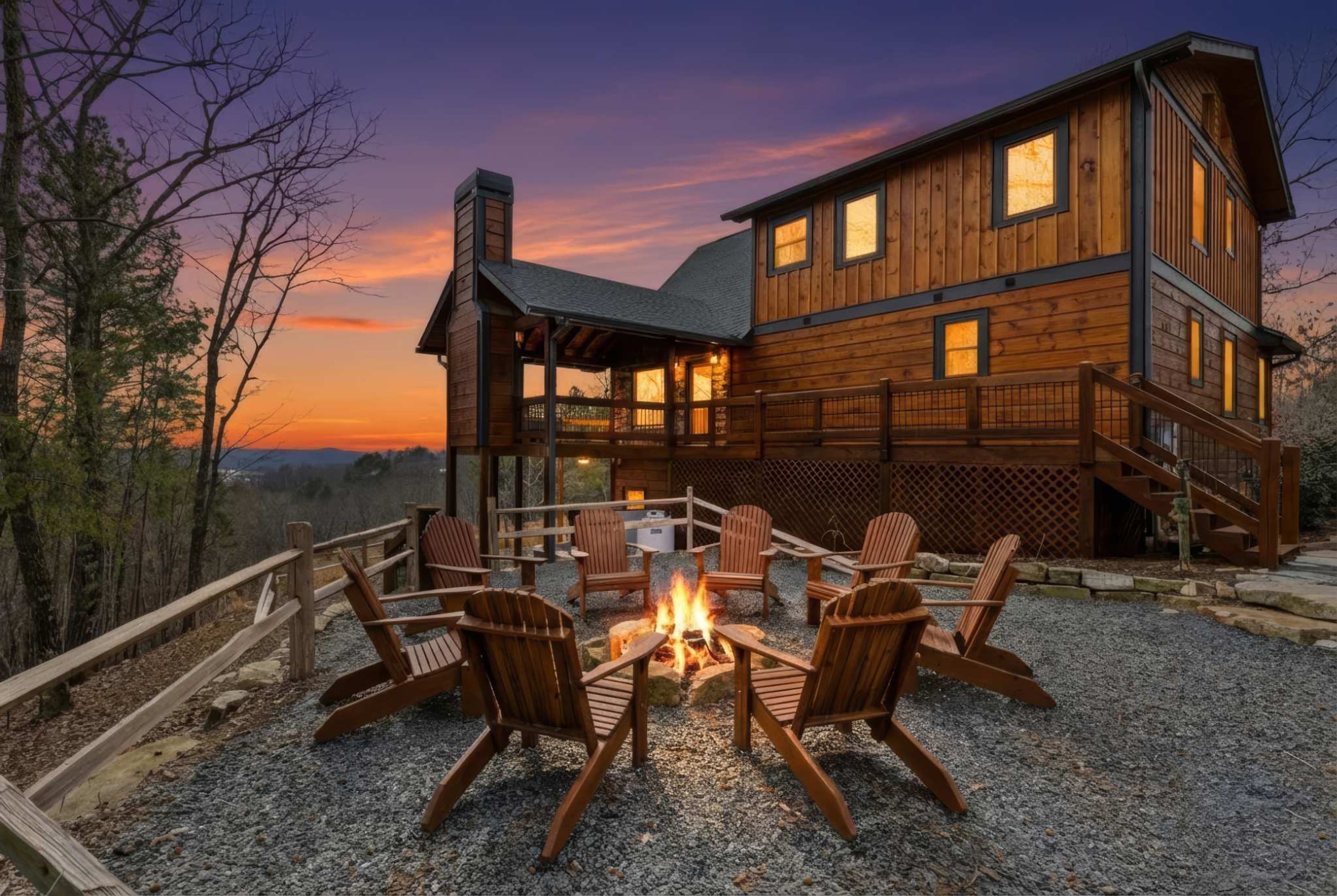 A wooden cabin with a fire pit and outdoor seating.