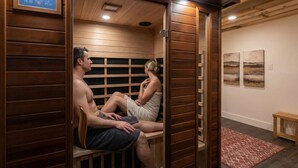 A sauna room with wooden walls and a control panel. - Mountain View - Rooftop Patio - Theater - Games (Gatlinburg)