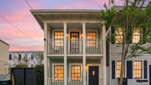 A two-story building with a balcony on the second floor, a front door, and a number '307' on the door. - Charming Savannah Getaway Hot Tub Sleeps 8 (Savannah)