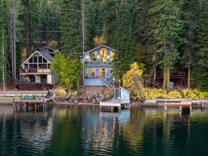 A lakeside cabin with a dock, surrounded by dense forest. - Donner Lake Retreat Hot Tub Game Room (Truckee)
