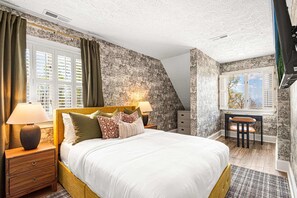 A bedroom with a large bed, two bedside tables, a desk, and a chair. - 14k sq ft Mountaintop Estate - Private Golf Course (Fletcher)