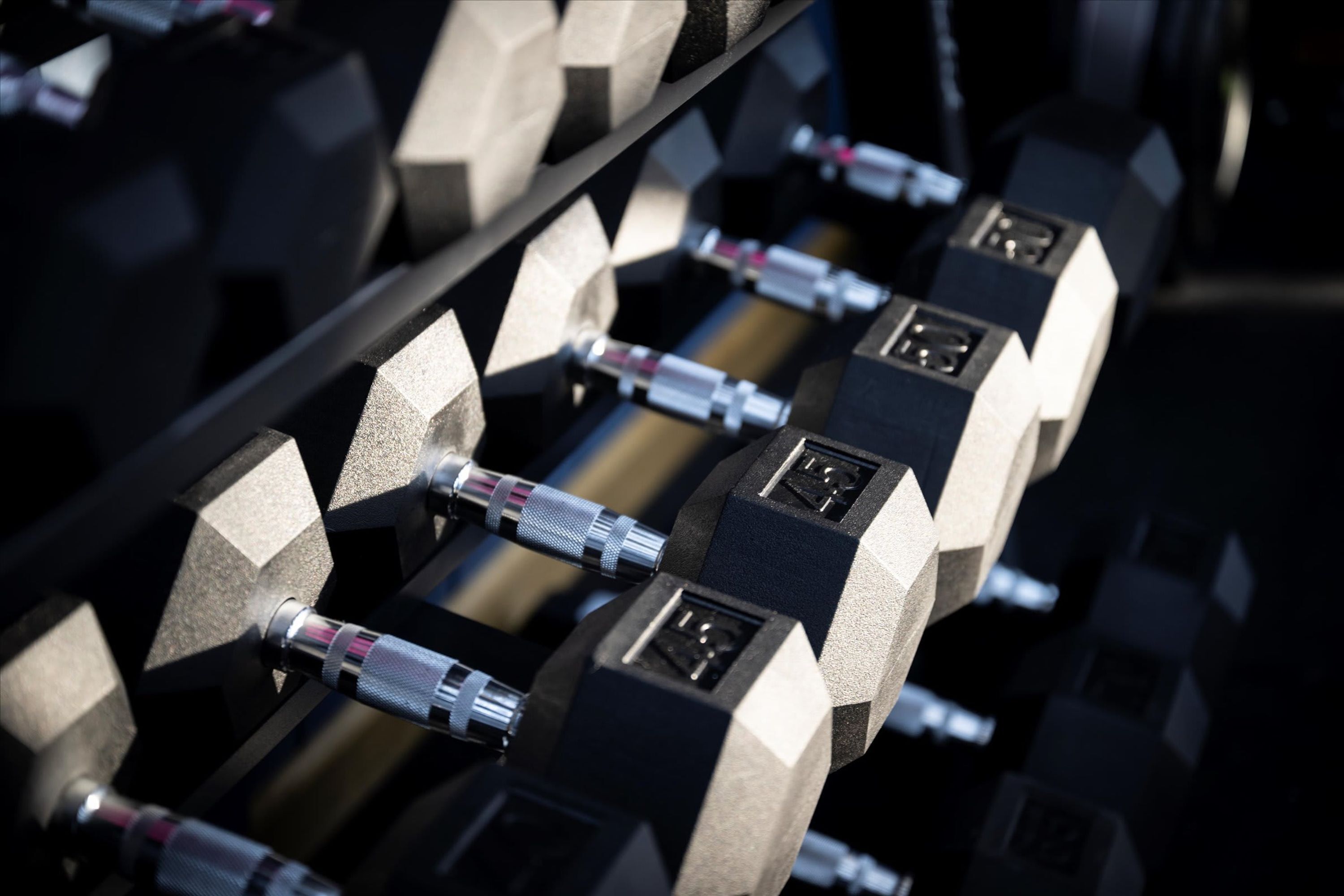 A close-up of a metallic structure with geometric shapes and connectors.