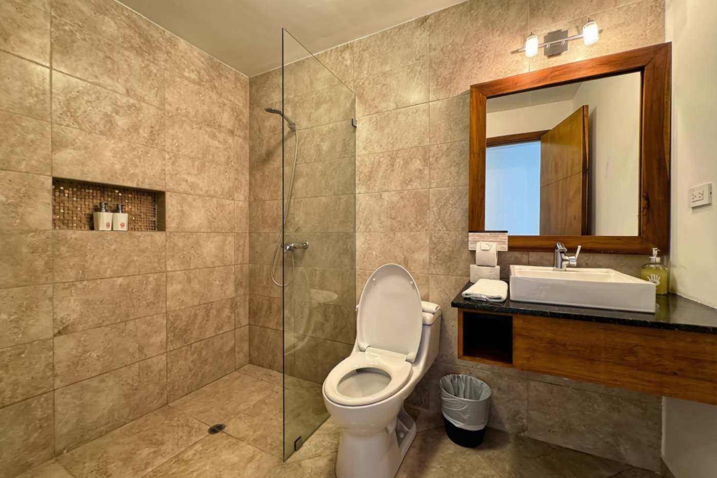 Shower, hair dryer, towels, shampoo