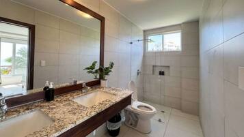 Shower, hair dryer, towels, shampoo