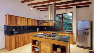 Coffee/tea maker, fridge, microwave, dining tables