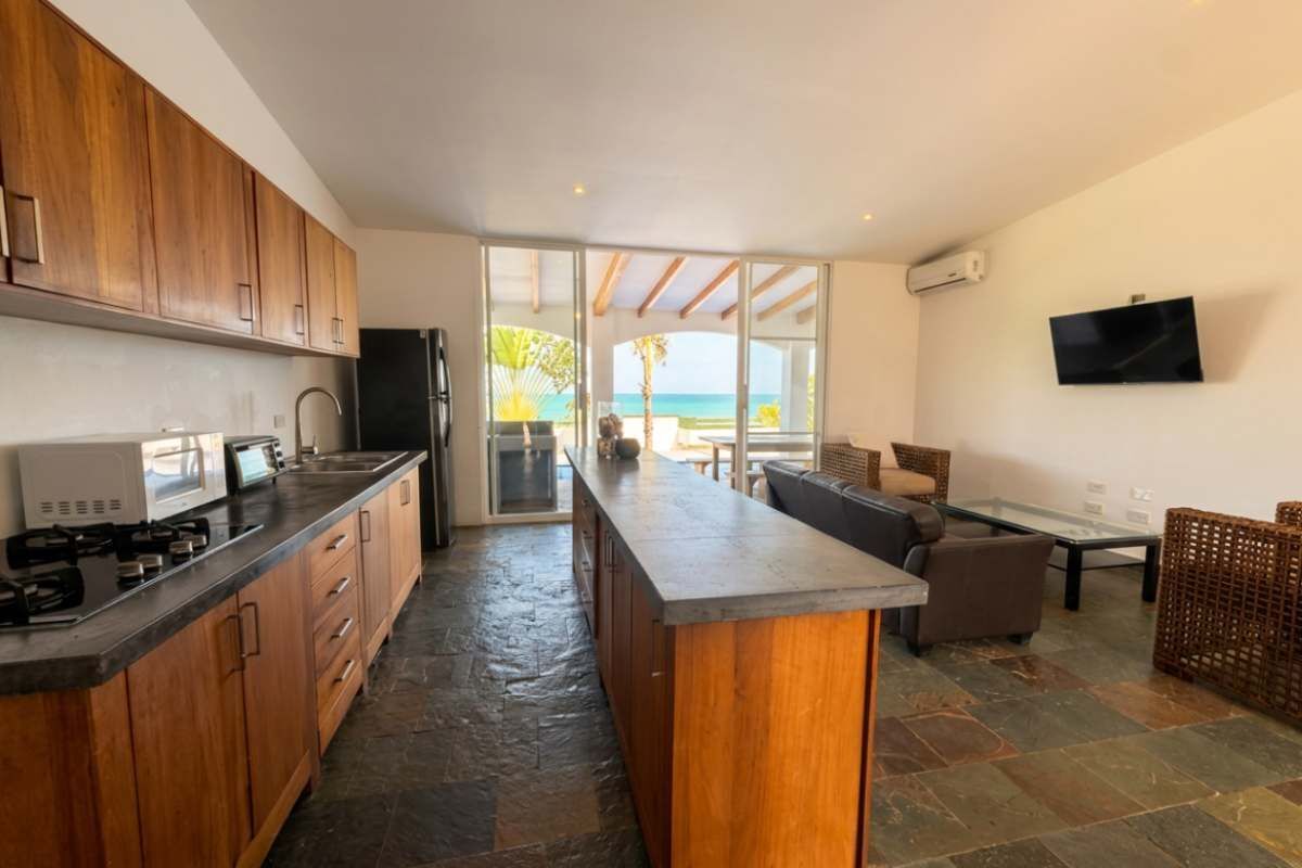 Coffee/tea maker, fridge, microwave, dining table
