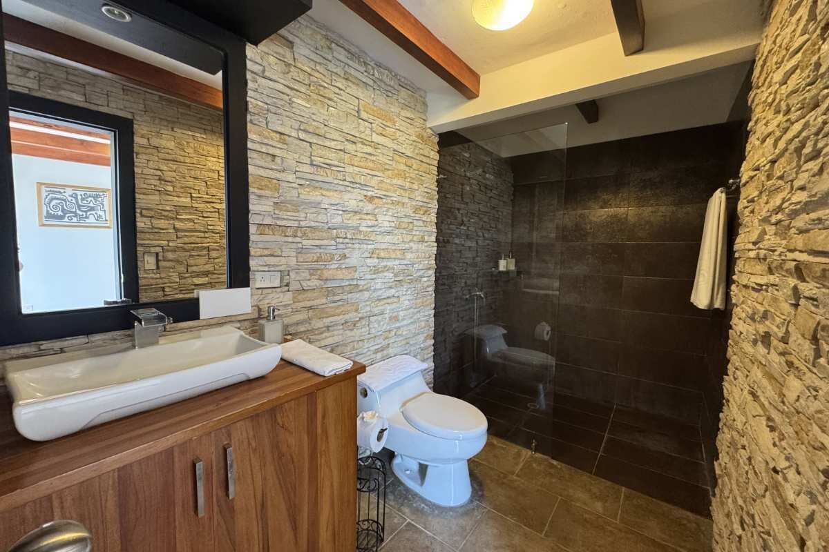 Shower, hair dryer, towels, shampoo