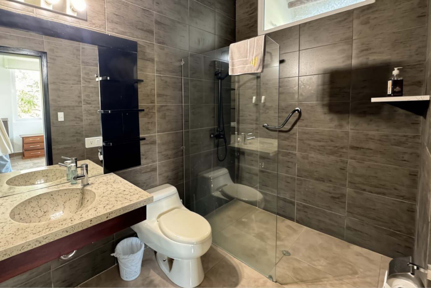 Shower, hair dryer, towels, shampoo