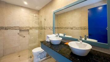Shower, hair dryer, towels, shampoo