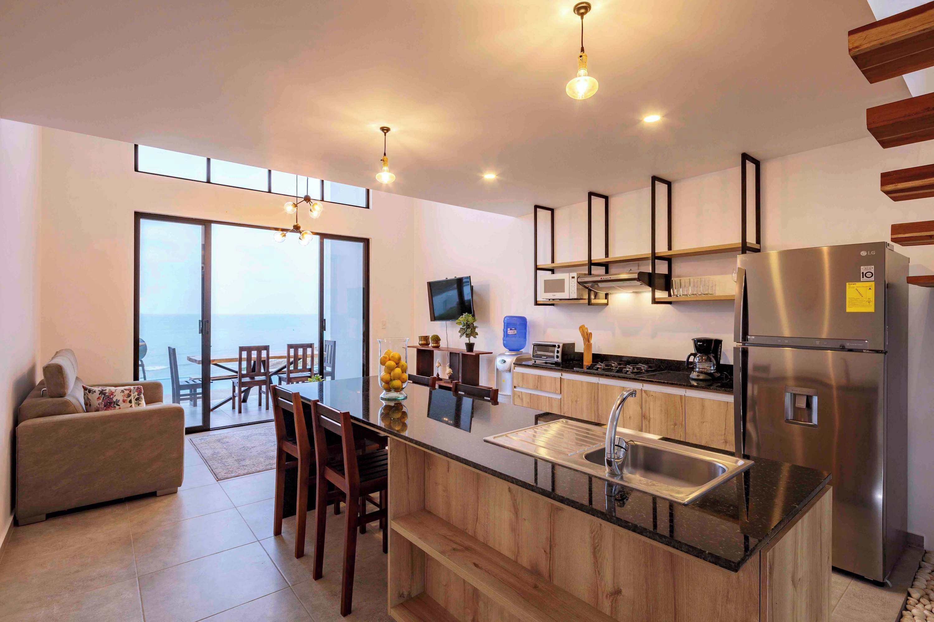 Coffee/tea maker, fridge, microwave, dining tables