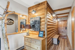 A wooden interior with a mirror, a sign reading 'MOOSE CREEK', and a wooden bench. - Two Bedroom, Two Bath with Easy Ski Access and Mountain Views (Breckenridge)