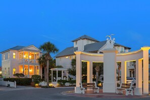 A two-story building with a balcony and a gazebo with benches. - Suncerre- 100 Steps to Private Beach & Pool in Carillon Beach (Panama City Beach)