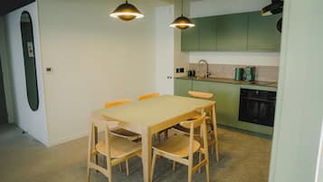 Family Apartment, 2 Bedrooms, Kitchen | Private kitchen | Fridge, microwave, stovetop, high chair
