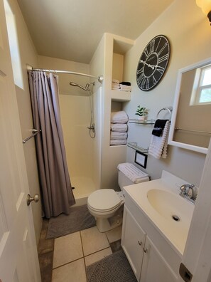 Shower, hair dryer, towels, soap