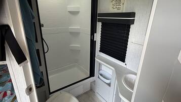 Shower, hair dryer, towels, soap