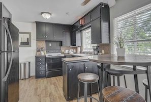 Coffee/tea maker, fridge, microwave, dining tables - Pet-Friendly 2BR Penthouse with Mountain Views + Private Deck (Colorado Springs)