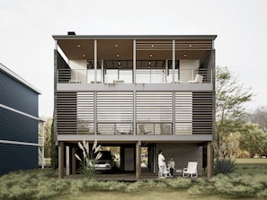 A modern two-story building with a flat roof, large windows, and a covered outdoor seating area. - Summer 2027 - Brand New Luxury Vacation Rental in Lewes, Delaware, 5 bedrooms (Lewes)