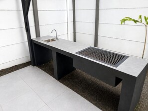 A modern outdoor kitchen with a sink and ventilation. - Villa Isora, New Villa with Private Pool, Playa Negra, Puerto Viejo. (Puerto Viejo de Talamanca)