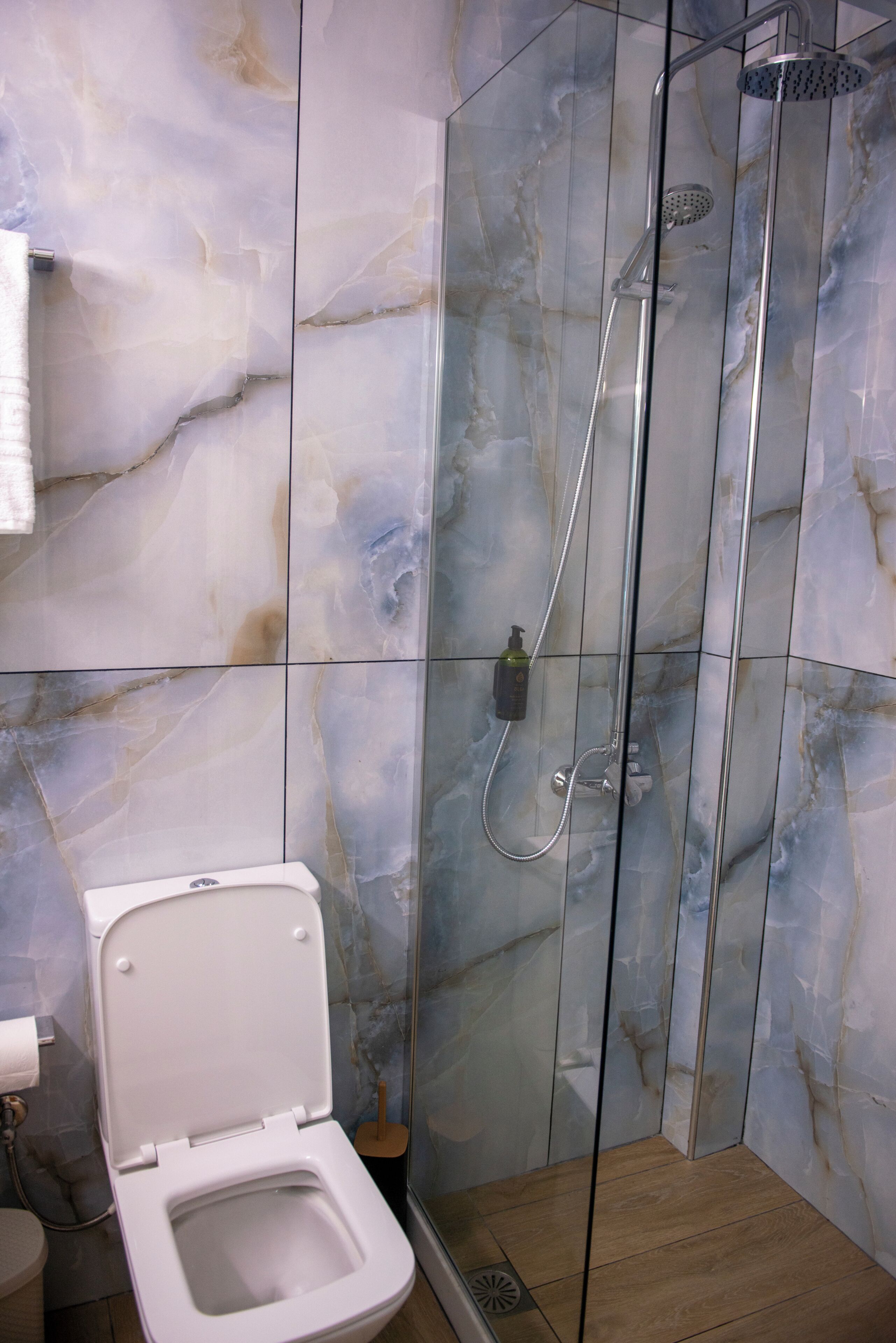 Shower, hair dryer, towels, toilet paper