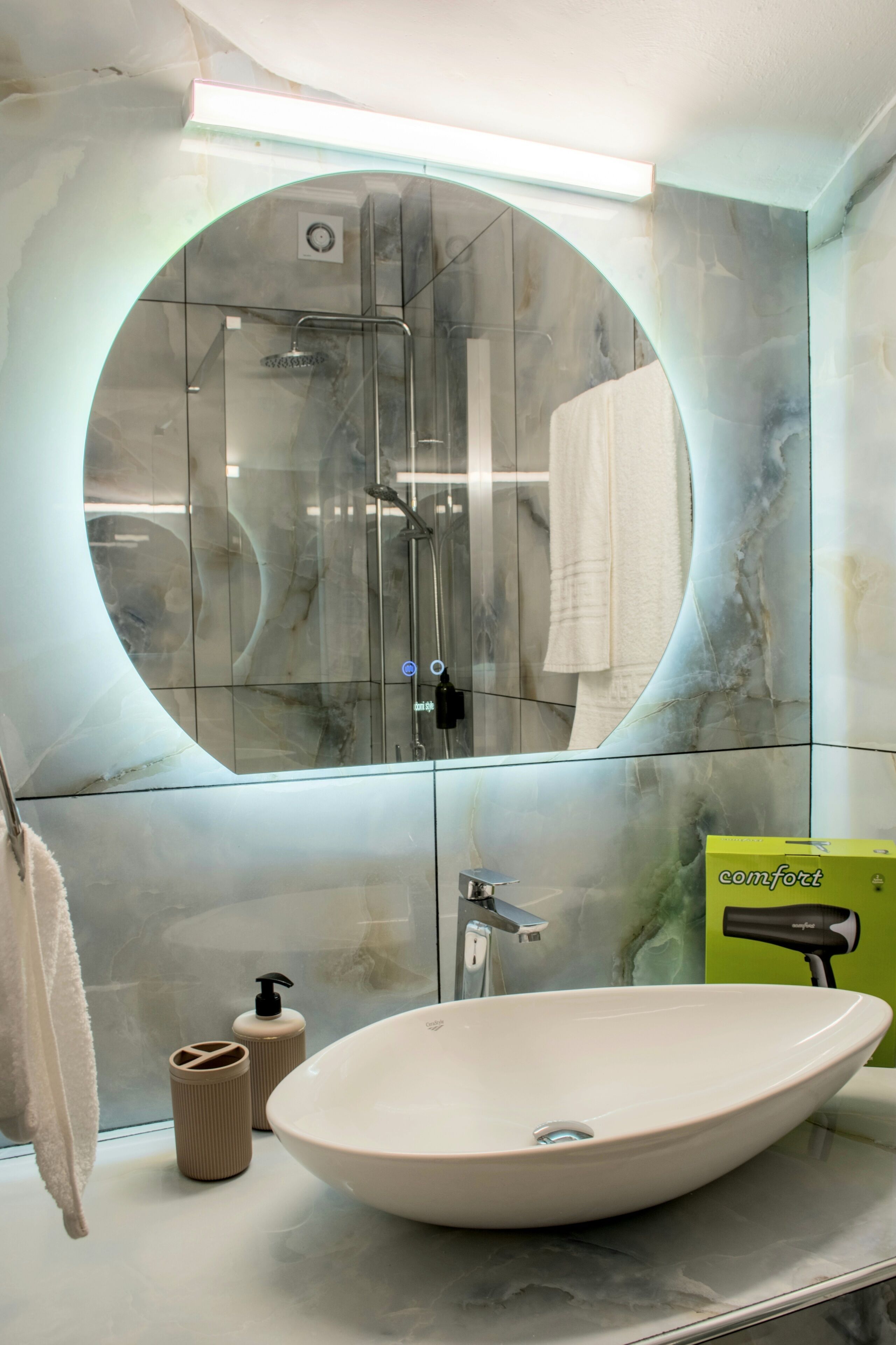 Shower, hair dryer, towels, toilet paper