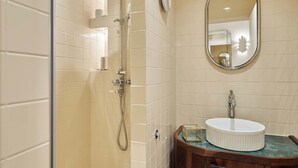 A bathroom with a shower, a sink, and a mirror. - Sublim new Triplex on Place des Vosges (Paris)