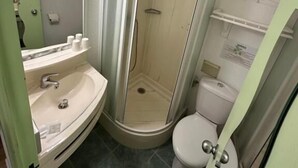 A bathroom with a shower, toilet, and sink. - HAVANA (Malay-le-Grand)