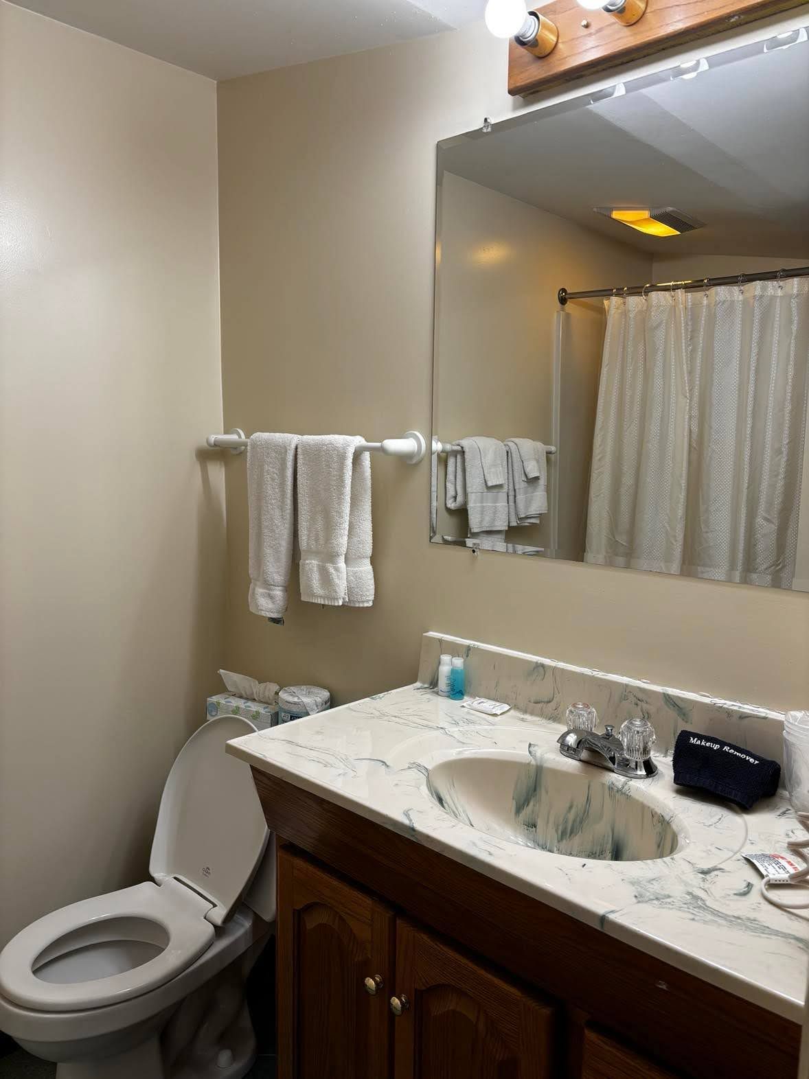 Hair dryer, towels, soap, toilet paper