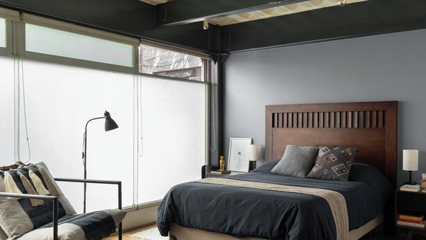 A modern bedroom with a large bed, a desk, and a chair. - Casa Maryna. (Villa de Cos)