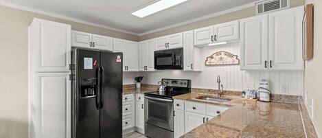 Coffee/tea maker, fridge, microwave, oven