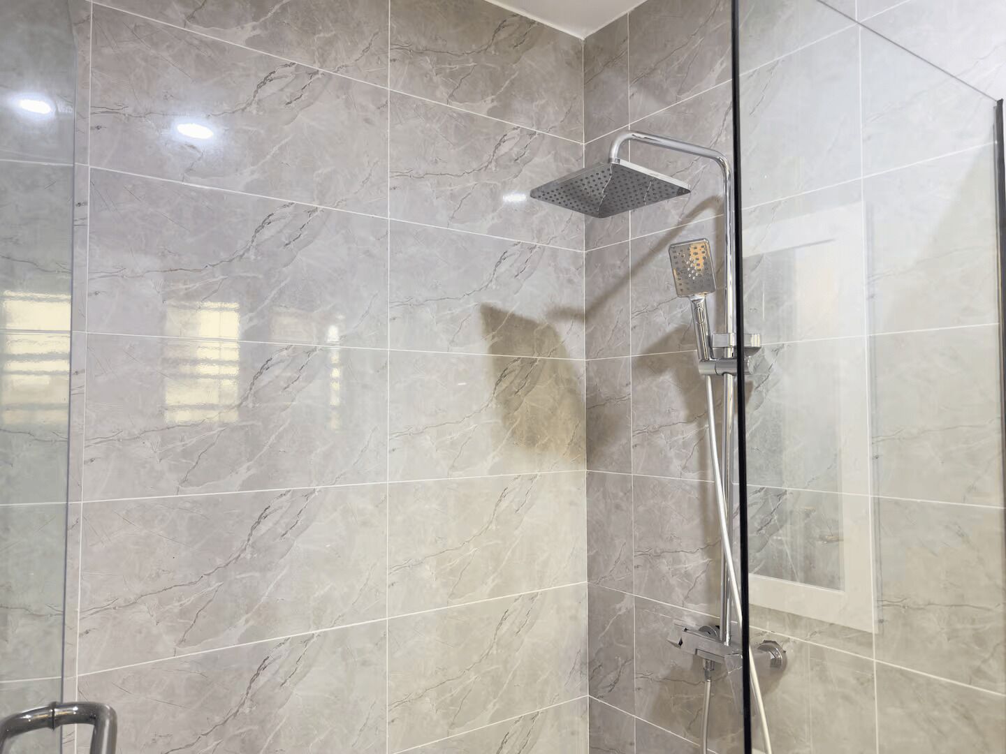 Shower, eco-friendly toiletries, towels, soap