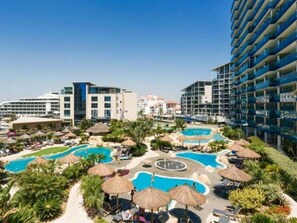 A resort with multiple swimming pools, lounge areas, and a large hotel building. - Gibraltar Luxury w/ Rooftop Pools & Views (Gibraltar)