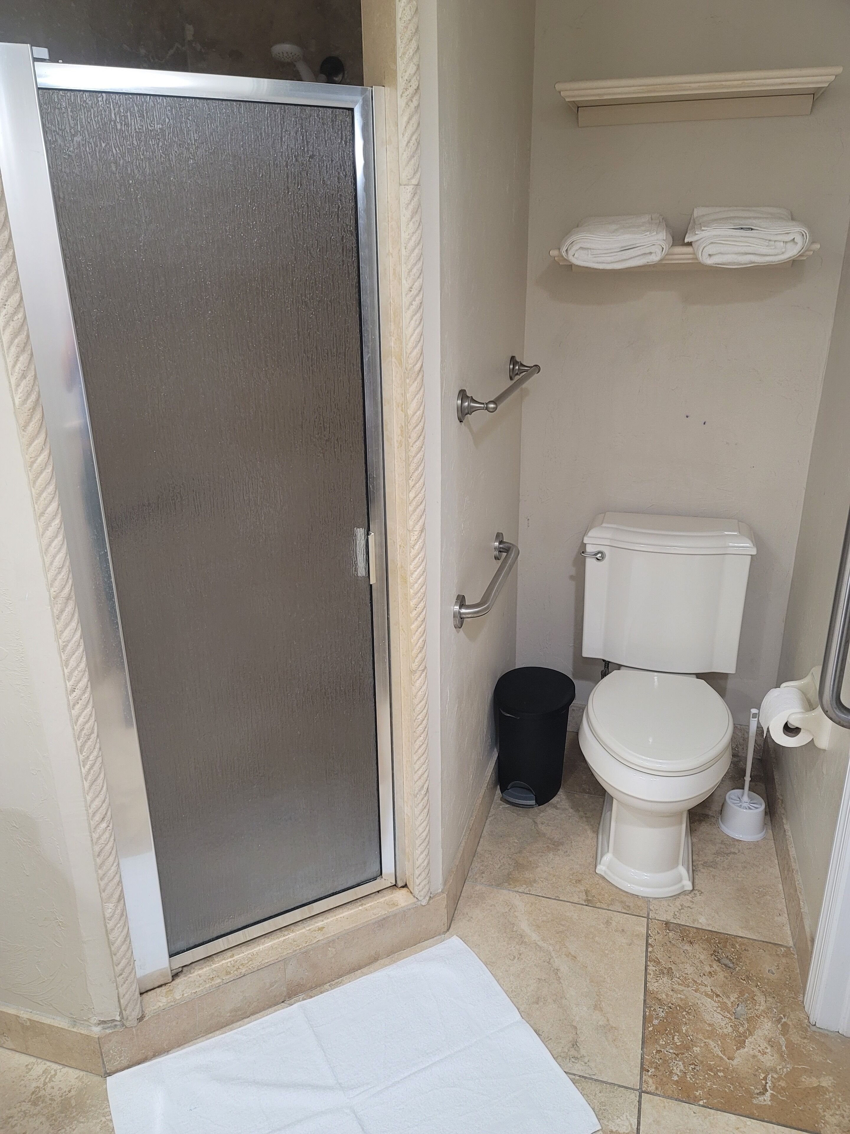 Shower, jetted bath, towels, soap