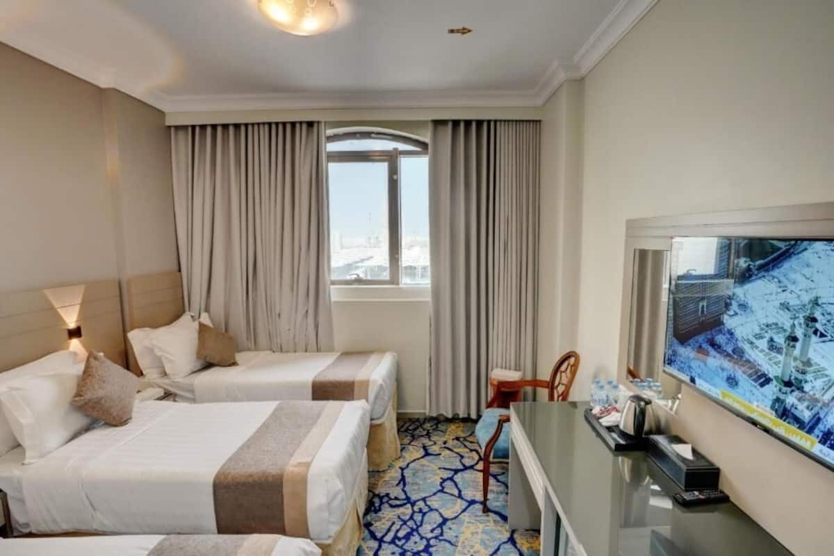 Habitación triple Deluxe | Minibar, wifi gratis y ropa de cama