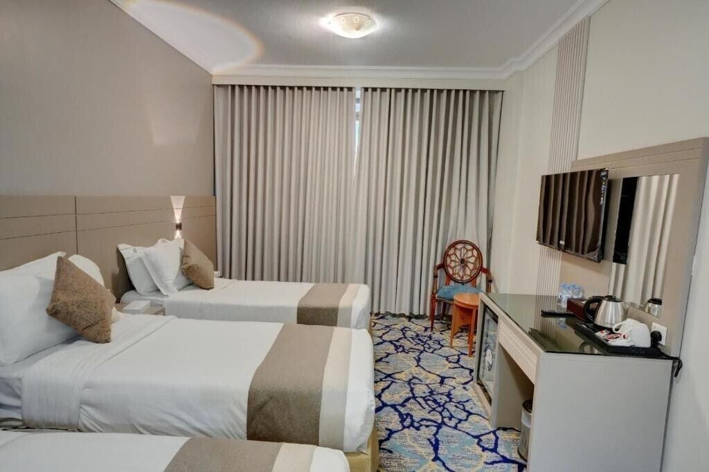 Deluxe-Dreibettzimmer