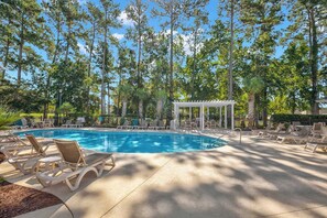 A swimming pool with lounge chairs and a gazebo surrounded by trees. - World Tour Fairway Condo • Pool • 10 Min to Beach (Myrtle Beach)