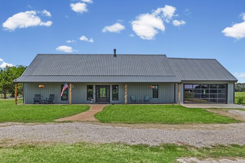77-acre river ranch with farmhouse spa, game room, ponds, trails and family fun.