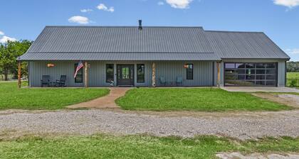77-acre river ranch with farmhouse spa, game room, ponds, trails and family fun.