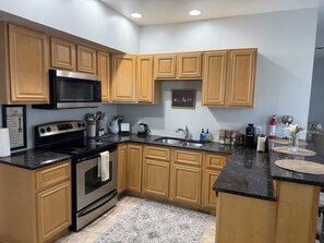 Coffee/tea maker, fridge, microwave, oven