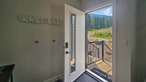 A door with a view of a deck and a mountain landscape. - Newest Nordix Townhome Premium ski in/out Location (Panorama)