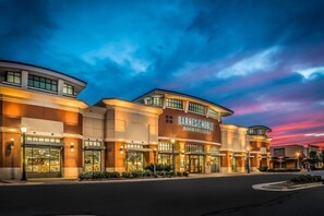 A multi-story building with a prominent 'Barnes & Noble Booksellers' sign.
