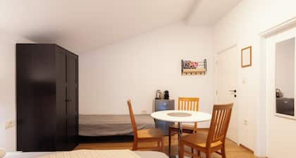 A comfortable family room with secure parking near the city center.