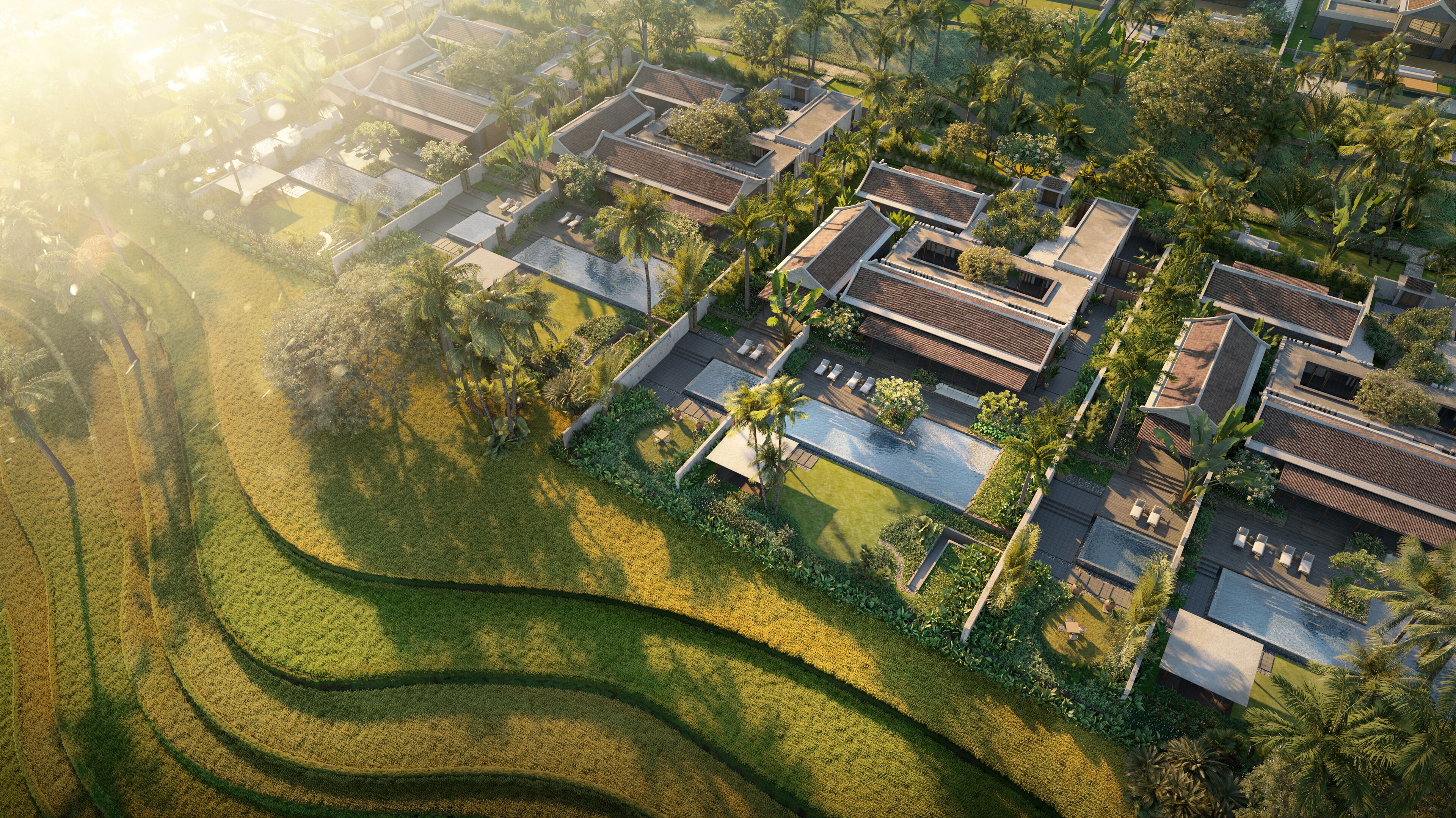 Vue aérienne d’un quartier résidentiel avec des maisons modernes, une piscine et des jardins bien entretenus.