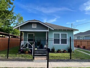 A single-story house with a front porch, a mailbox, and a number '4208' on the door. - Dino's Place - Minutes from Downtown Houston. (Houston)