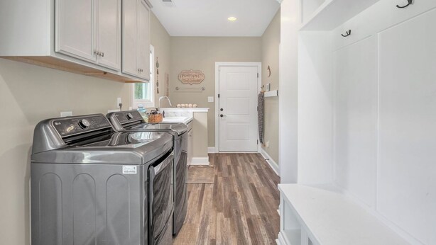 A laundry room with a washing machine, dryer, and a sink. - Luxury pro golf & equestrian retreat with pool and gym. Peaceful retreat 6BD/4BR (Carthage)