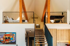 A staircase with wooden railings leading to a second-floor balcony. - Vineyard Panorama Villa With Pool And Sauna (Jastrebarsko)