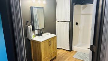 Shower, towels, soap, toilet paper