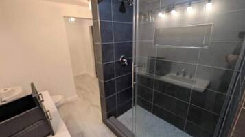 Shower, towels, soap, toilet paper